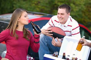 image of drinking at college football tailgate, for when getting caught drinking on college campus and need an experienced criminal defense attorney in Cincinnati